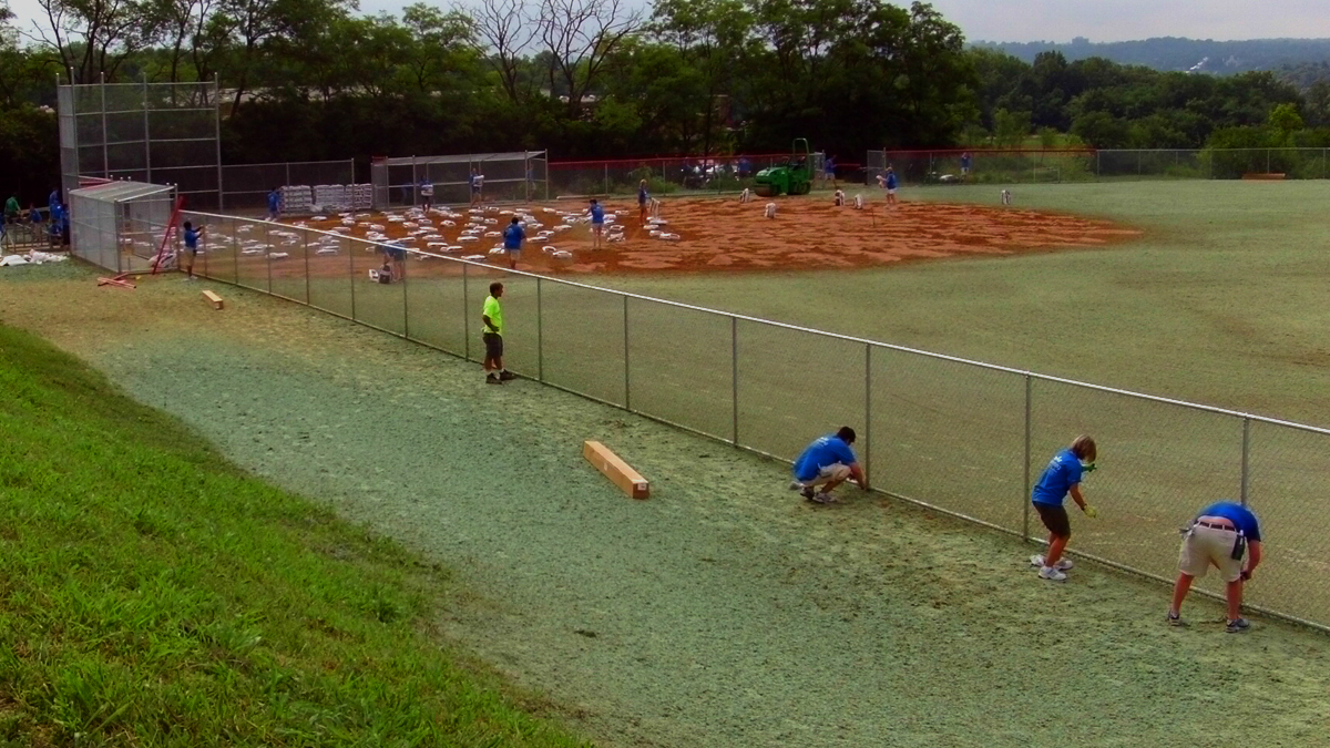 Chain link baseball field fencing, dugouts and backstop install by Ashlee.