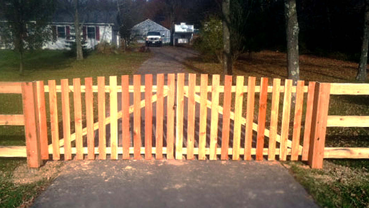 A wood fence and gate will enhance your property's natural beauty.